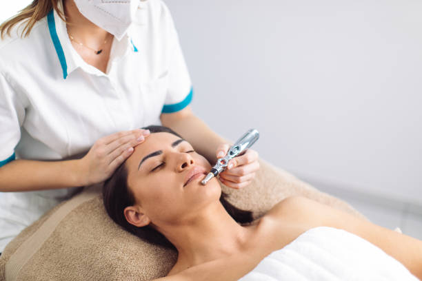 Woman receiving facial treatment in a spa.